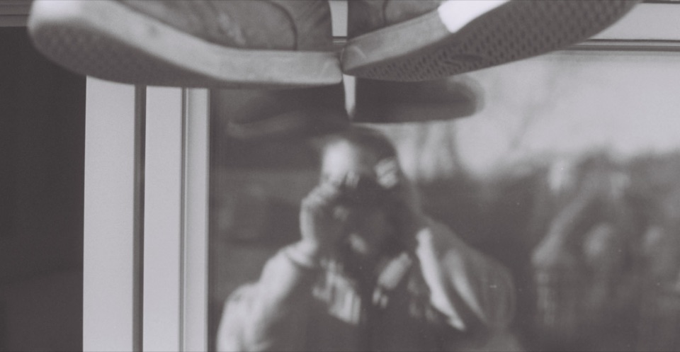 A reflection with shoes overhead in black and white