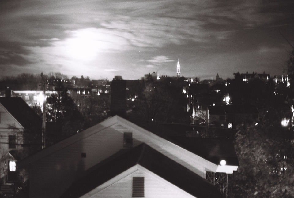 Burlington rooftops and lights at night in black and white