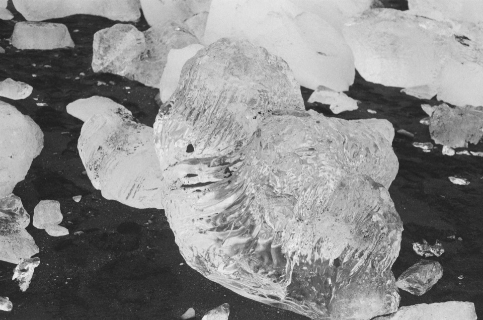 Ice resting on black sand at Diamond Beach