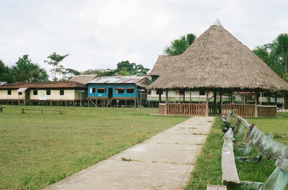 Buildings around a clearing in the Peruvian Amazon